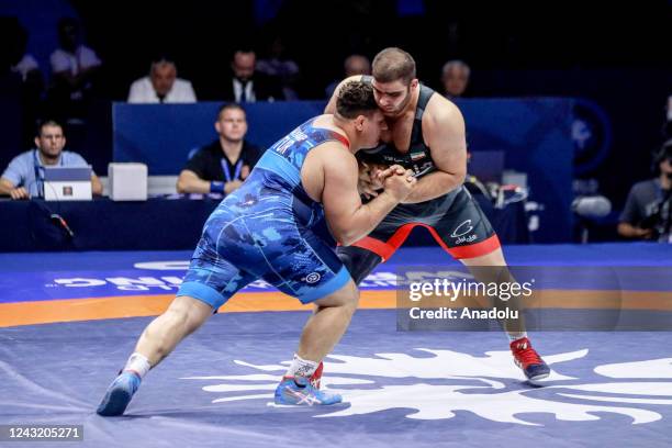 Turkish wrestler Riza Kayaalp in action against Amin Mirzazadeh of Iran during the 130kilos Men's Greco-Roman style final at the World Wrestling...