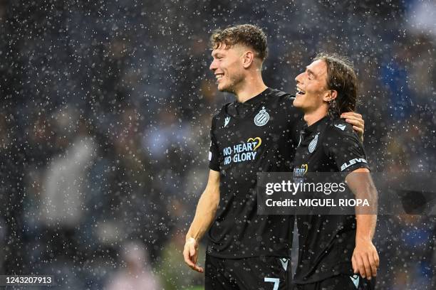 Club Brugge's Danish midfielder Andreas Skov Olsen and Club Brugge's Danish midfielder Casper Nielsen celebrates at the end of the UEFA Champions...