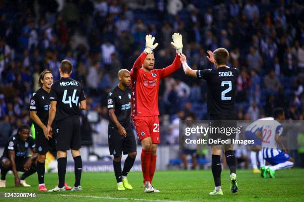 Simon Mignolet of Club Brugge and Eduard Sobol of Club Brugge celebrates after winning during the UEFA Champions League group B match between FC...