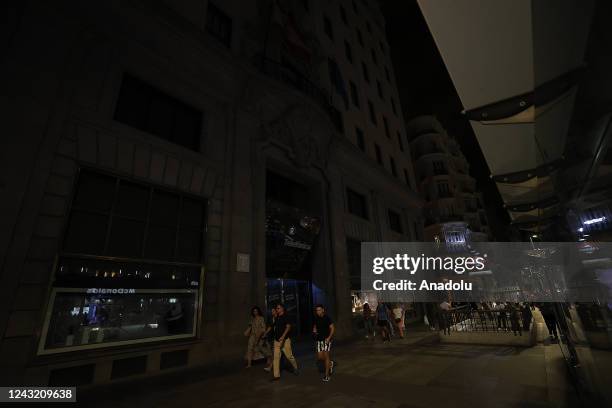 View of a street where some buildings turn off lights whereas some others keep lights on in Madrid, Spain on September 13, 2022. According to the...