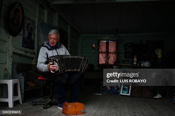 Musician Norberto Gradilone plays his bandoneon in "Caminito" in Buenos Aires, on September 9, 2022. - Like every year, Buenos Aires once again...