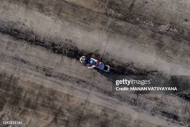 This aerial photo taken on September 11, 2022 shows tyre marks as a Thai drag racer on his modified motorbike takes part in the NGO Street Drag Race...