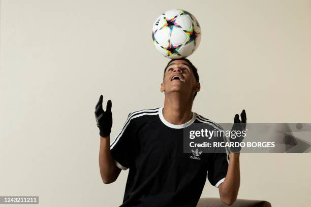 Brazilian digital influencer Iran Ferreira, known as "Luva de Pedreiro," poses for a picture in Rio de Janeiro, Brazil, on September 11, 2022. - Luva...