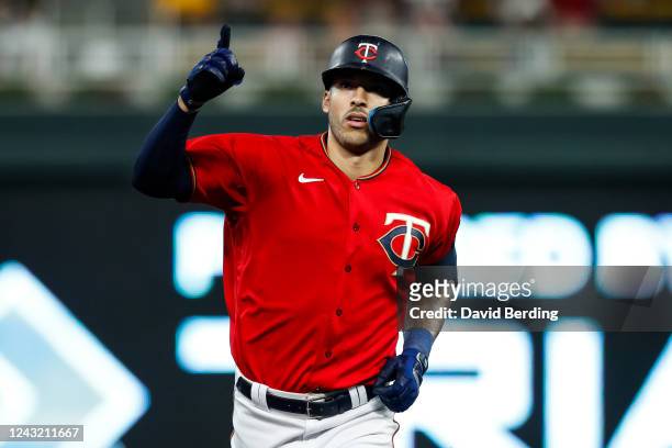 Carlos Correa of the Minnesota Twins celebrates his two-run home run as he rounds the bases against the Kansas City Royals in the fifth inning of the...