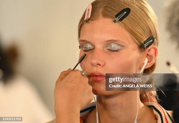 Model's makeup is done backstage for the Tory Burch Spring/Summer 2023 fashion show during New York Fashion Week in New York on September 13, 2022.