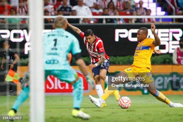 Carlos Cisneros of Chivas fights for the ball with Samir De Souza of Tigres during the 9th round match between Chivas and Tigres UANL as part of the...