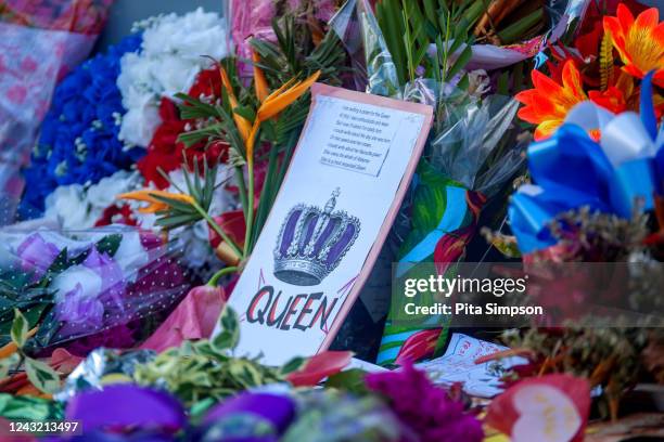 Condolence messages from kindergarten students from the Early Learning Centre along with flowers are seen outside Victoria House, the British High...