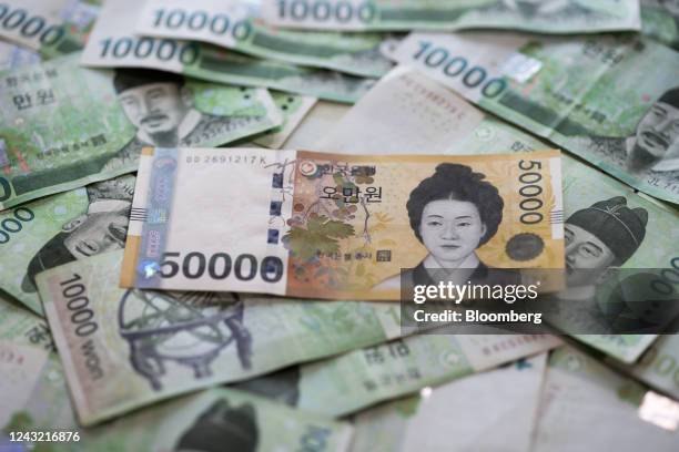 South Korean 50,000 won and 10,000 won banknotes arranged for a photograph in Seoul, South Korea, Sept. 14, 2022. Policy makers in Asia pushed back...