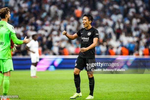 Kevin TRAPP and Makoto HASEBE of Frankfurt celebrate the victory after the UEFA Champions League match between Marseille and Eintracht Frankfurt at...