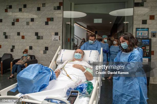 Hospital patient Isidre Correa leaves the hospital as he is taken to the seaside by intensive health care staff outside the Hospital del Mar on June...