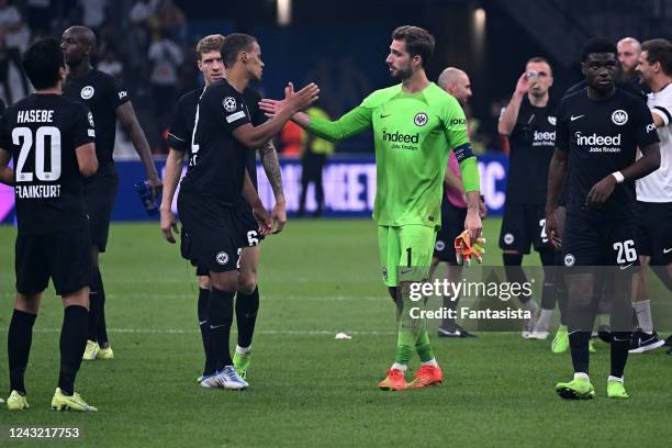 Kristijan Jakic of Eintracht Frankfurt, Timothy Chandler of Eintracht Frankfurt and Kevin Trapp of Eintracht Frankfurt celebrate the win after the...