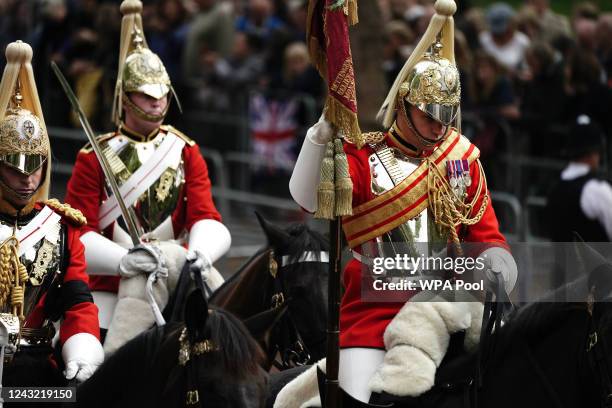 Members of the Life Guards household cavalry on the Mall ahead of the ceremonial procession of the coffin of Queen Elizabeth II from Buckingham...