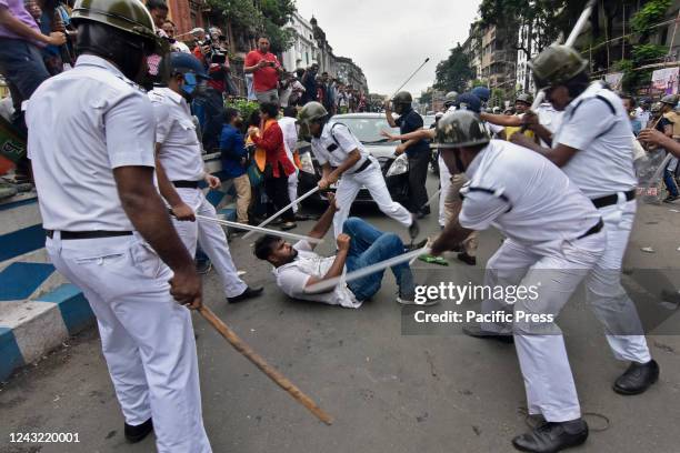 Police personnel charged with Lathi during the Nabanna Abhijan to protest against against alleged corrupt practices of TMC Government. The BJP has...