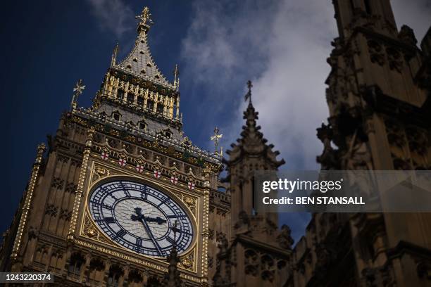 Face of Big Ben, the clock at Palace of Westminster is pictured during a the ceremonial procession of the coffin of Queen Elizabeth II to Westminster...