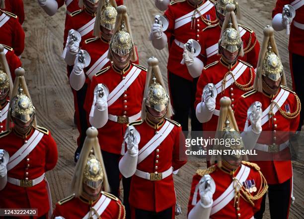 Life Guards, a unit of the Household Cavalry, arrive at the Palace of Westminster, following the procession of he coffin of Queen Elizabeth II from...