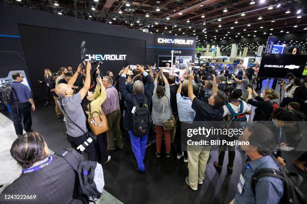 Members of the news media swarm Steve Majoros, Vice President of Chevrolet Marketing, after the Chevy press conference at the 2022 North American...