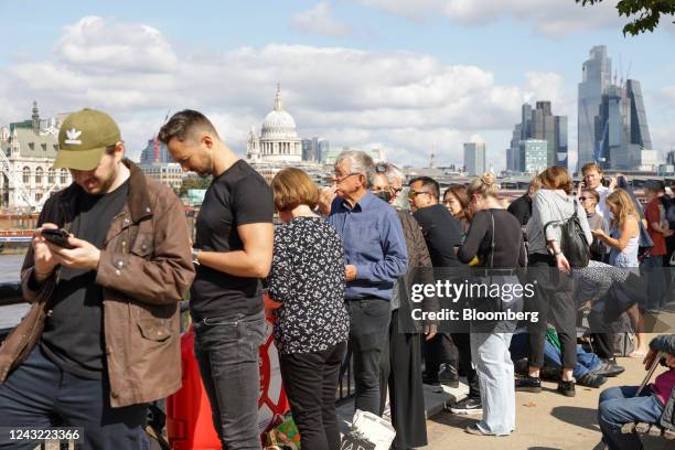 Members of public in the queue at South Bank, to see Queen Elizabeth II's coffin lying in state at Westminster Hall, in London, UK, on Wednesday,...