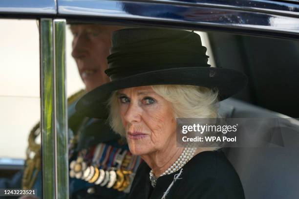 King Charles III and Camilla, Queen Consort leave Westminster Hall after the ceremonial procession of the coffin of Queen Elizabeth II from...