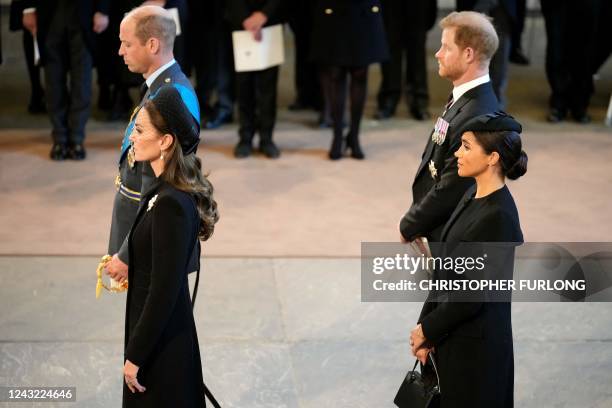 Britain's Prince William , Prince of Wales, Britain's Catherine , Princess of Wales, Britain's Prince Harry , Duke of Sussex, and Meghan , Duchess of...