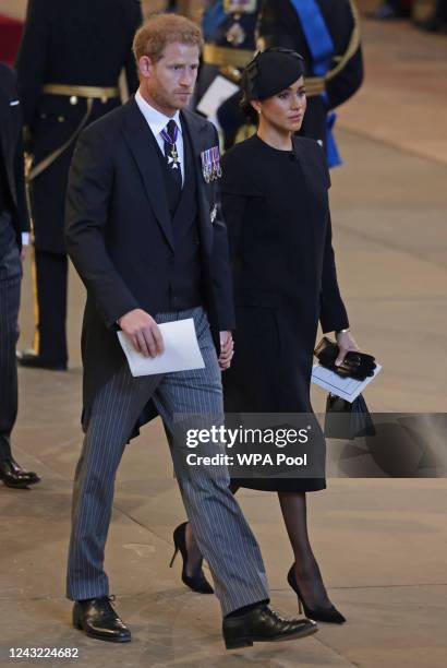 Prince Harry, Duke of Sussex and Meghan, Duchess of Sussex leave Westminster Hall on September 14, 2022 in London, United Kingdom. Queen Elizabeth...