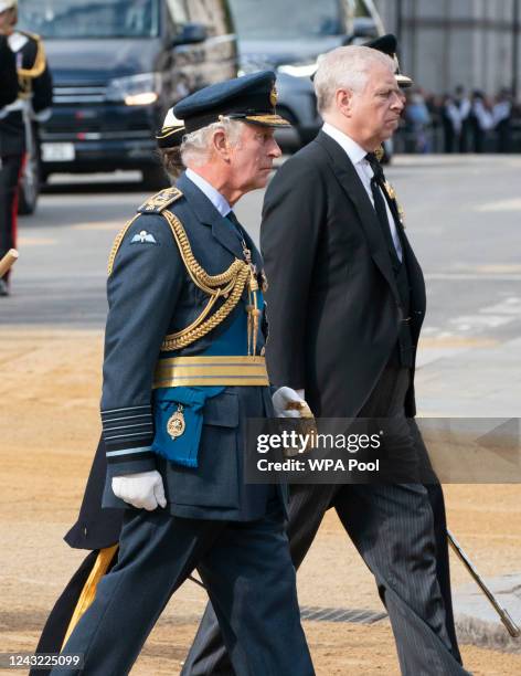 King Charles III, Princess Anne, Princess Royal and Prince Andrew, Duke of York walk behind Queen Elizabeth II's coffin is taken in procession on a...