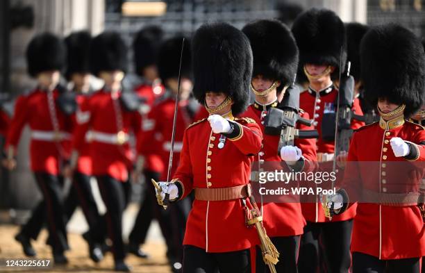 Grenadier Guards take part in the ceremonial procession of Queen Elizabeth II's coffin from Buckingham Palace to the Palace of Westminster on...