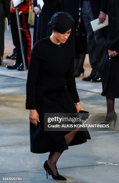 Meghan, Duchess of Sussex pays her respects inside Westminster Hall, at the Palace of Westminster, where the coffin of Queen Elizabeth II, will Lie...