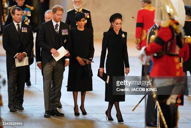 Peter Phillips, Britain's Prince Harry, Duke of Sussex, Meghan, Duchess of Sussex and Britain's Catherine, Princess of Wales attend a service for the...