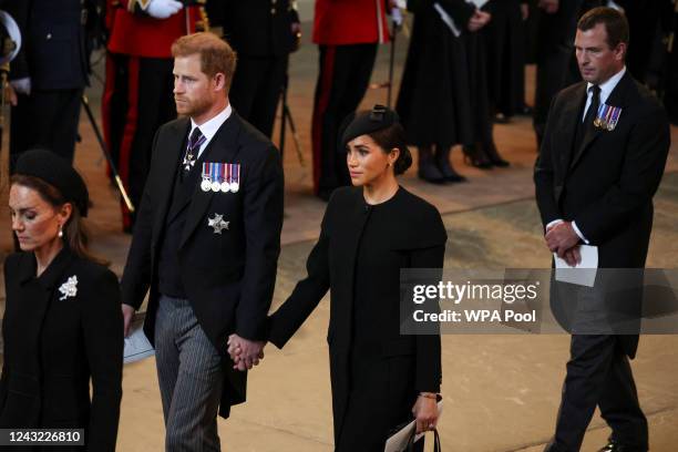 Catherine, Princess of Wales, Prince Harry, Duke of Sussex and Meghan, Duchess of Sussex and Peter Phillips arrive in the Palace of Westminster after...