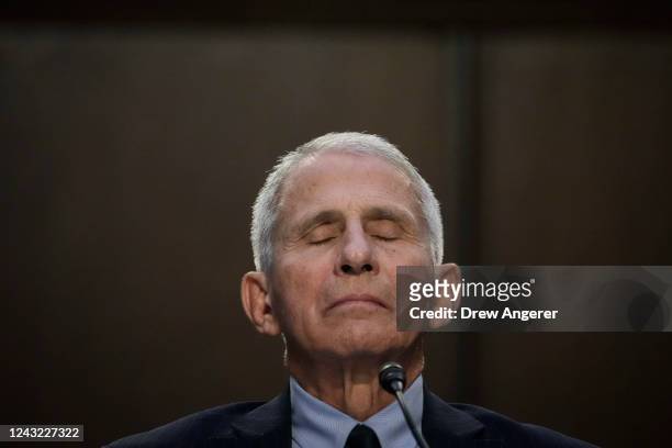 Dr. Anthony Fauci, director of the National Institutes of Allergy and Infectious Diseases, pauses while testifying during a Senate Committee on...