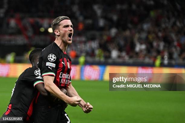 Milan's Belgian forward Alexis Saelemaekers celebrates after scoring during the UEFA Champions League Group E football match between AC Milan and...