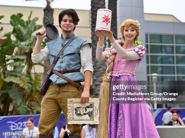 Anaheim, CA Isaac Sprague and Taylor Chapman are dressed as Flynn Rider and Rapunzel from Disneys Tangled during the D23 Expo in Anaheim, CA, on...