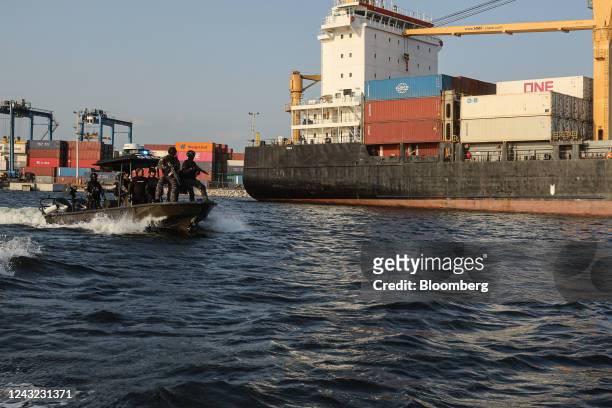 Members of Ecuador's Special Mobile Anti-narcotics Group patrol the Port of Guayaquil, in Guayaquil, Ecuador, on Sunday, Sept. 11, 2022. During...