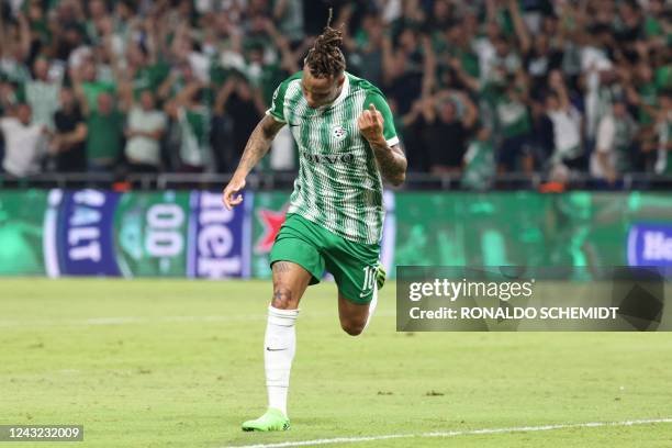 Maccabi Haifa's Surinamese midfielder Tjaronn Chery celebrates scoring the opener during the UEFA Champions League group H football match between...