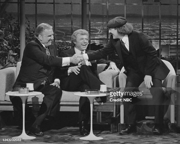 Pictured: Announcer Ed McMahon and musical guest Steve Lawrence greet comedian Gallagher on February 17, 1982 --