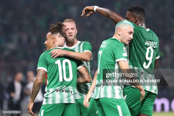 Maccabi Haifa's players celebrate scoring the opener during the UEFA Champions League group H football match between Israel's Maccabi Haifa and...