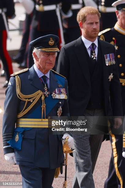 King Charles III, left, and Prince Harry follow the cortege carrying the coffin of Queen Elizabeth II to Westminster Hall in London, UK, on...