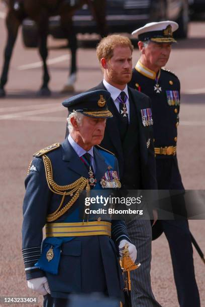 King Charles III and Prince Harry follow the cortege carrying the coffin of Queen Elizabeth II to Westminster Hall in London, UK, on Wednesday, Sept....