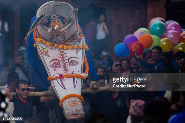 Nepalese devotees carry an elephant made from bamboo called Pulu Kishi, the mythical conveyance of lord Indra on the final day of a week-long Indra...