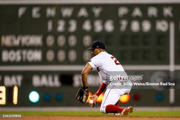 Xander Bogaerts of the Boston Red Sox makes an error as he attempts to field a ground ball during the fifth inning of a game against the New York...