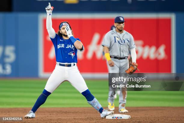 Bo Bichette of the Toronto Blue Jays celebrates on base as he hits a double in the eighth inning of their MLB game against the Tampa Bay Rays at...