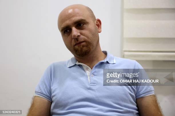 Qais Murad, 36-year-old former inmate at Sednaya prison prison on the outskirts of Damascus, gives an interview at his house in Gaziantep, in...