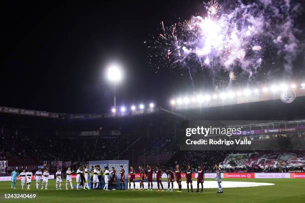 Fireworks are displayed as players of Bca Juniors and Lanus greet prior to a match between Lanus and Boca Juniors as part of Liga Profesional 2022 at...