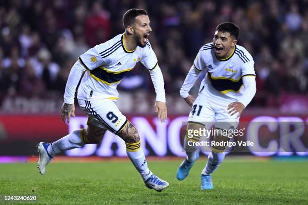 Dario Benedetto of Boca Juniors celebrates with teammate Luca Langoni after scoring the first goal of his team during a match between Lanus and Boca...
