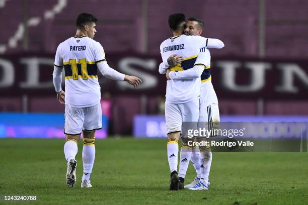 Dario Benedetto of Boca Juniors celebrates with teammate Martin Payero and Guillermo Fernandez after scoring the first goal of his team during a...