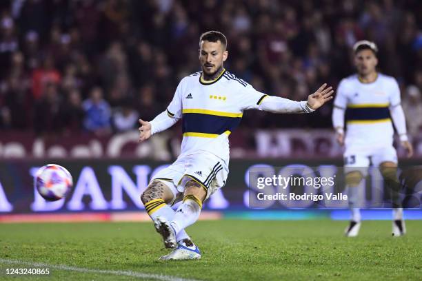 Dario Benedetto of Boca Juniors shoots on target and scores the first goal of his team during a match between Lanus and Boca Juniors as part of Liga...