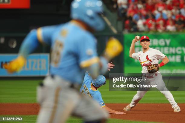 Tommy Edman of the St. Louis Cardinals throws to first base against the Milwaukee Brewers in the seventh inning at Busch Stadium on September 14,...