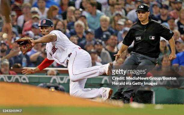 September 14: Rafael Devers of the Boston Red Sox dives for a catch and allows Gleyber Torres of the New York Yankees to advance to third during the...