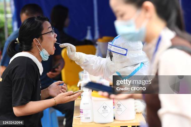 Medical staff conduct nucleic acid samples for residents at a nucleic acid sampling site in Guiyang, Guizhou province, China, Sept 15, 2022.