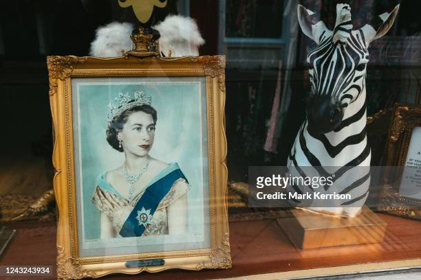 Framed portrait of Queen Elizabeth II is pictured in a shop window on 14th September 2022 in Eton, United Kingdom. Queen Elizabeth II, the UK's...
